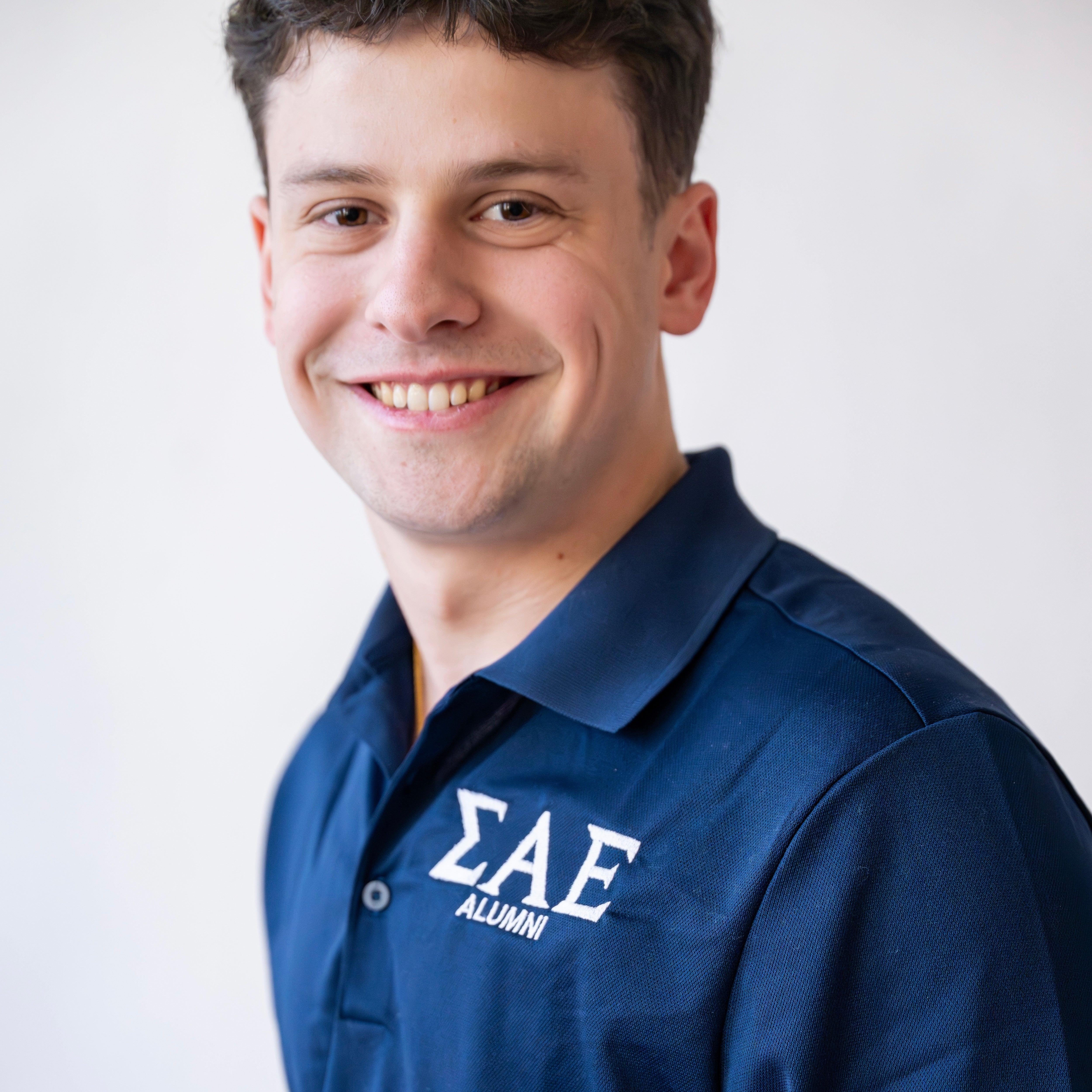 Basic Greek Letter "ALUMNI" Embroidered Polo