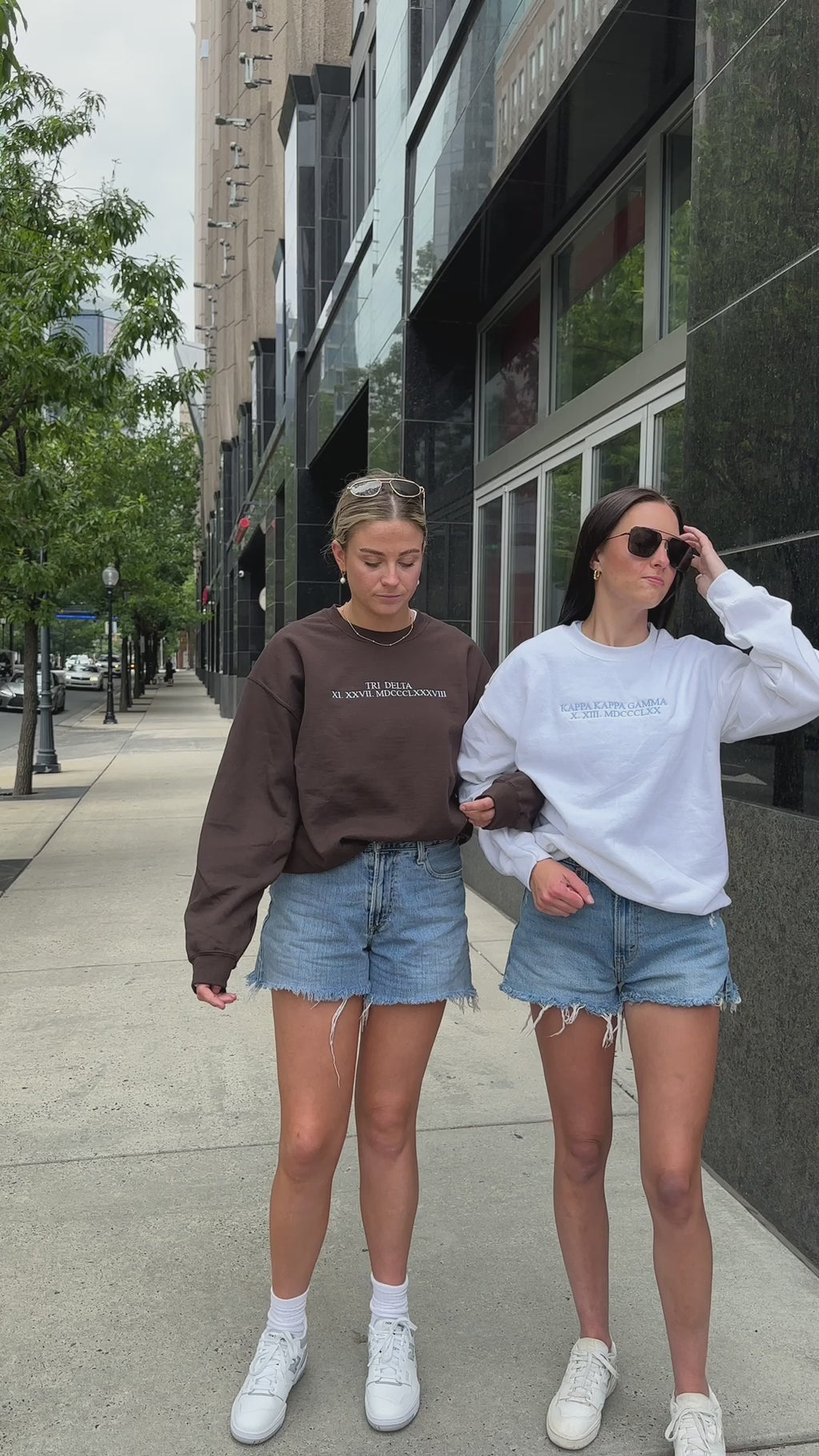 Timelessly True Embroidered Gildan Crew Neck Sorority Sweatshirt styled with two models in the uptown, city location