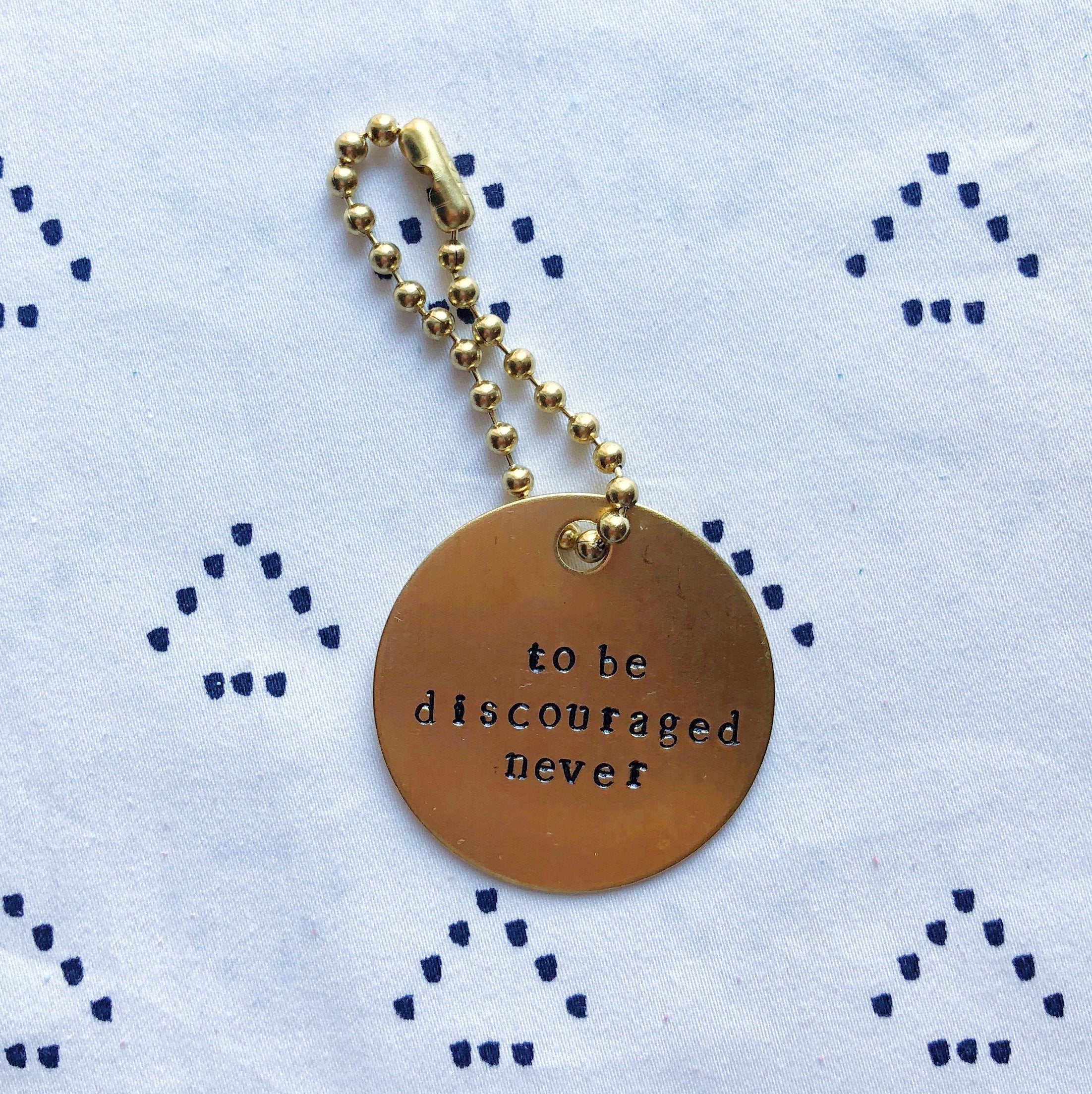 Sorority Symphony "To Be Discouraged Never" Hand-Stamped Keychain