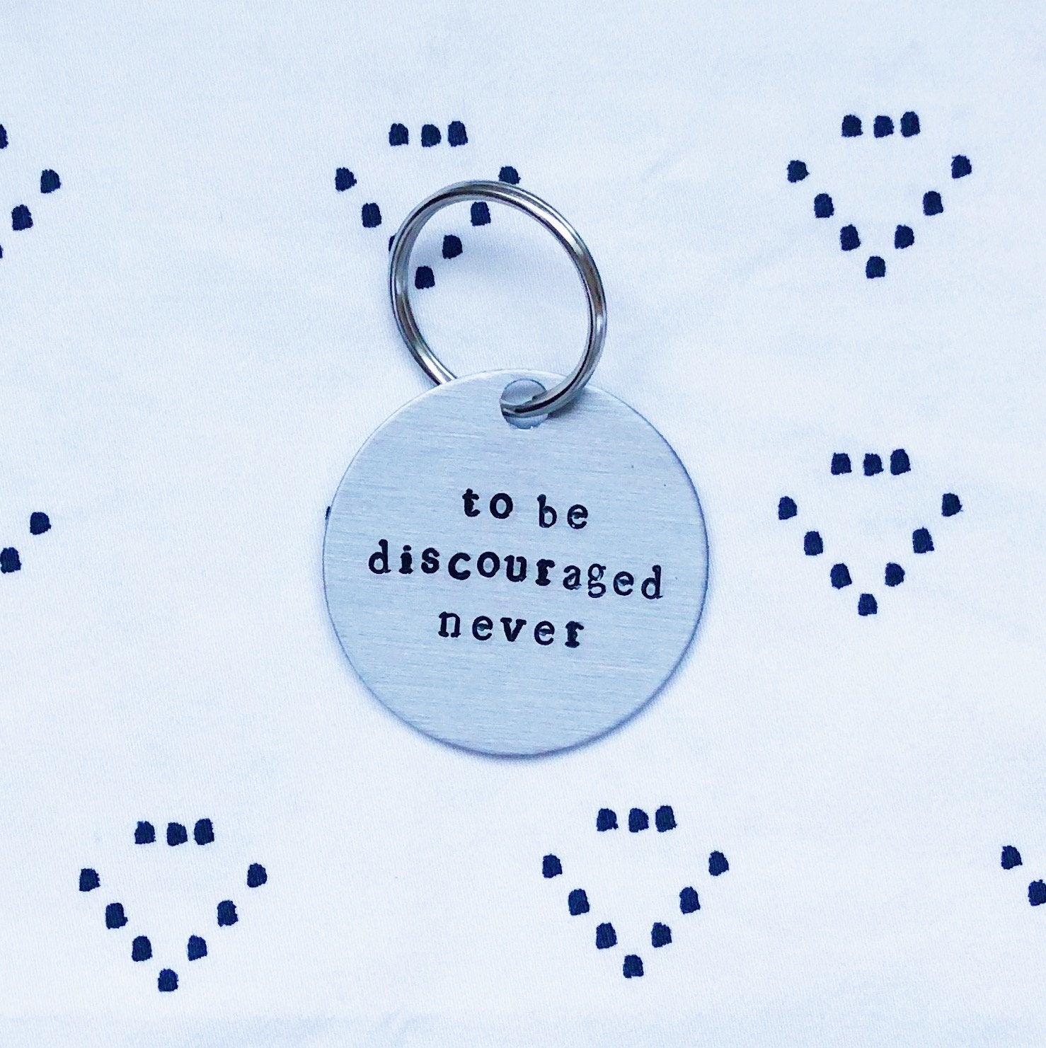 Sorority Symphony "To Be Discouraged Never" Hand-Stamped Keychain